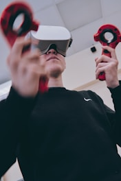 man in black using augmented reality goggles