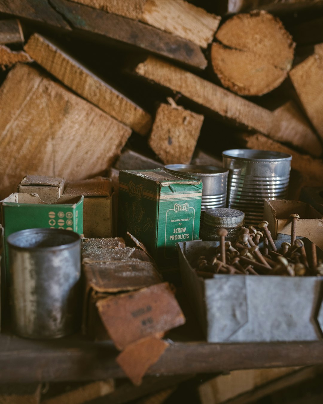 green and silver cans on brown wooden table