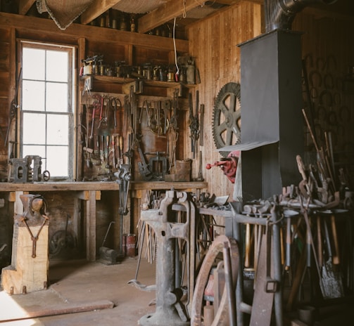 brown wooden cabinet near white and black sewing machine