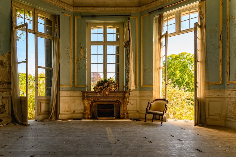 brown wooden armchair near window