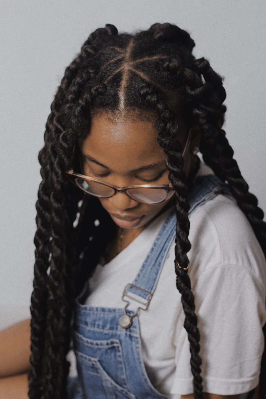 Woman in dungarees wearing long jumbo rope twists