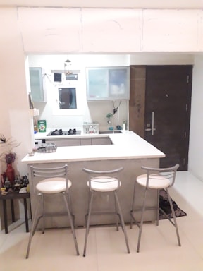 A stylish kitchen with modern appliances and a breakfast bar.