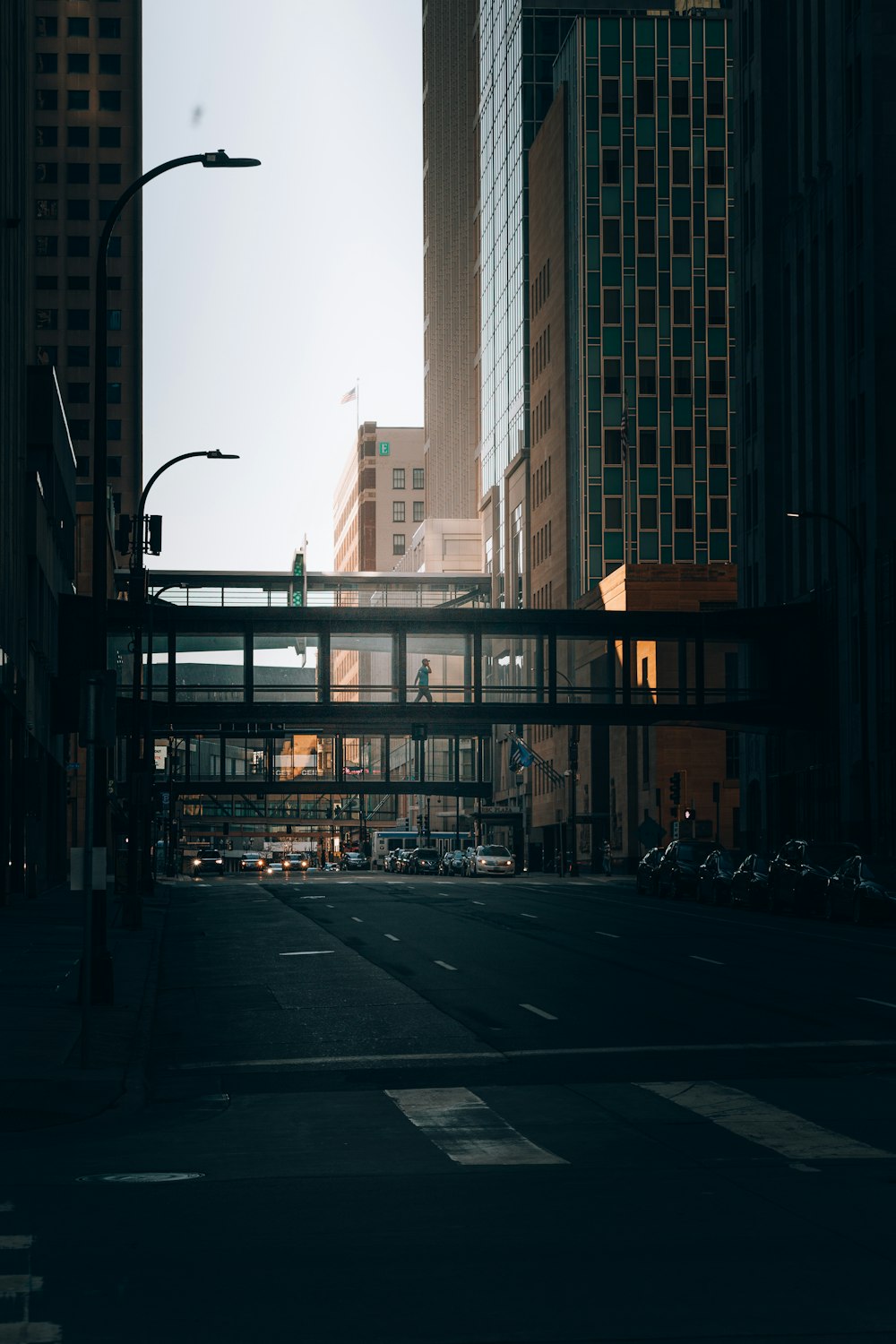 people walking on sidewalk near high rise buildings during daytime