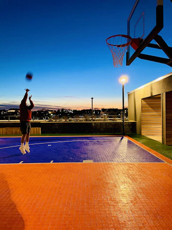 Action shot of a BlazeHoop player making a jump shot during a lively game at the Biggleswade court.