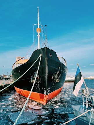 black and brown ship on sea during daytime