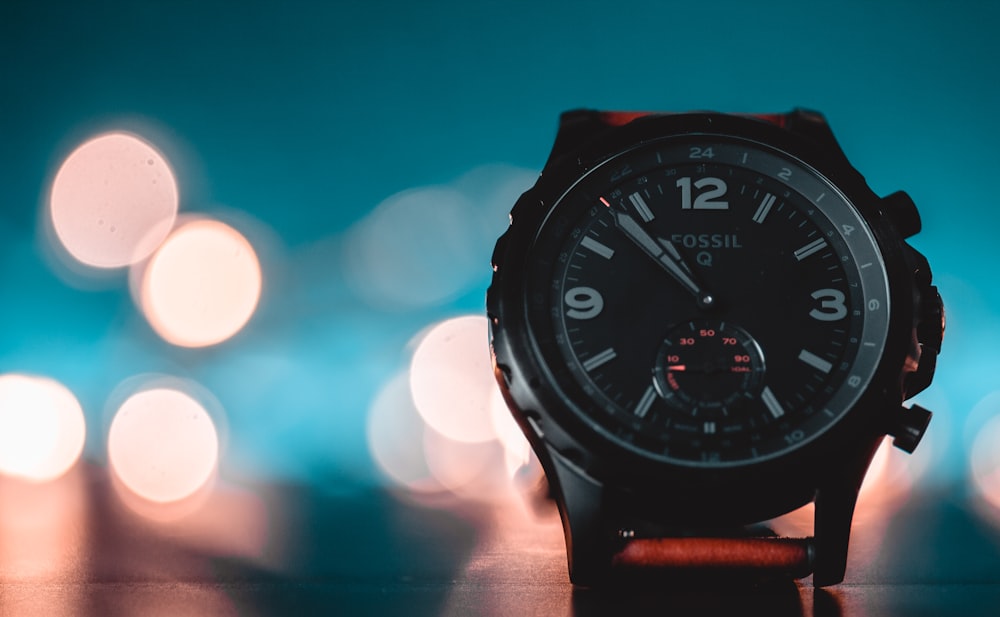 black and red analog watch