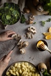 person holding stainless steel spoon with sliced lemon
