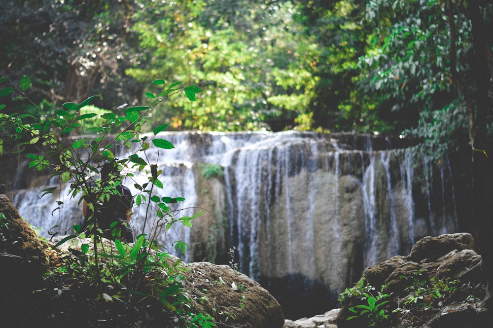 water falls on brown rock