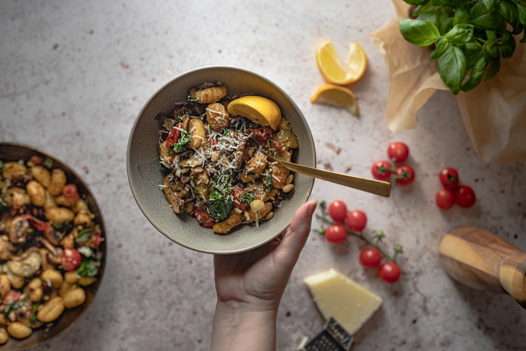 person holding bowl of food,
