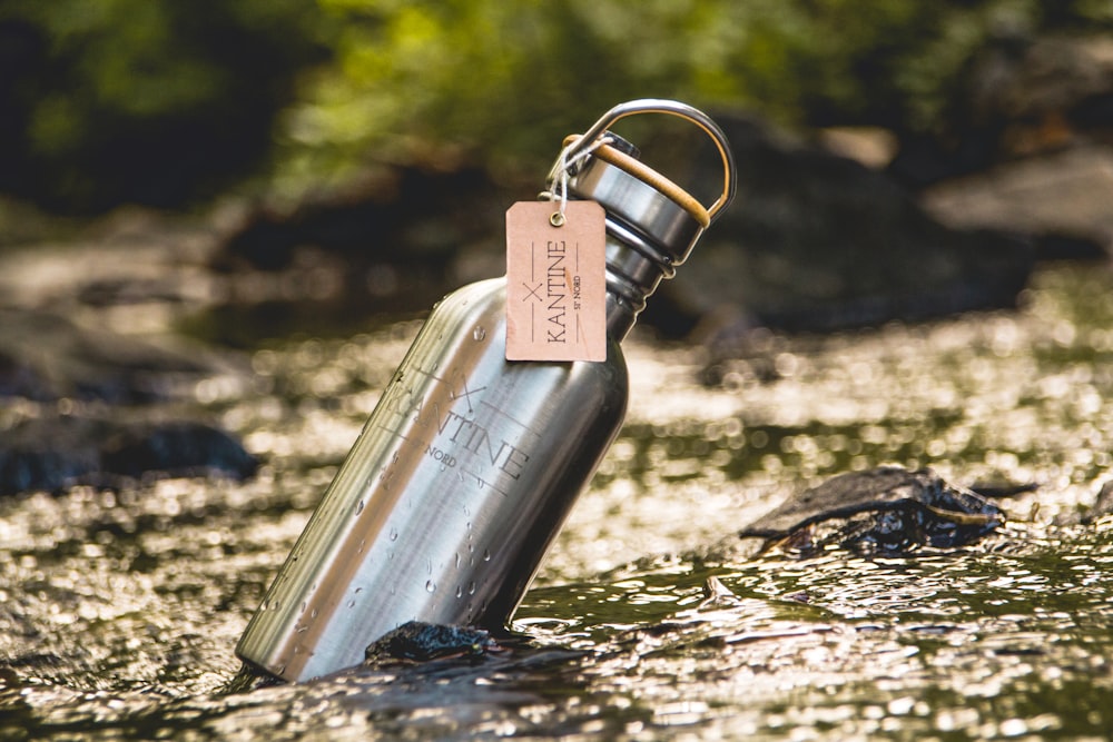 silver steel tube on gray rock