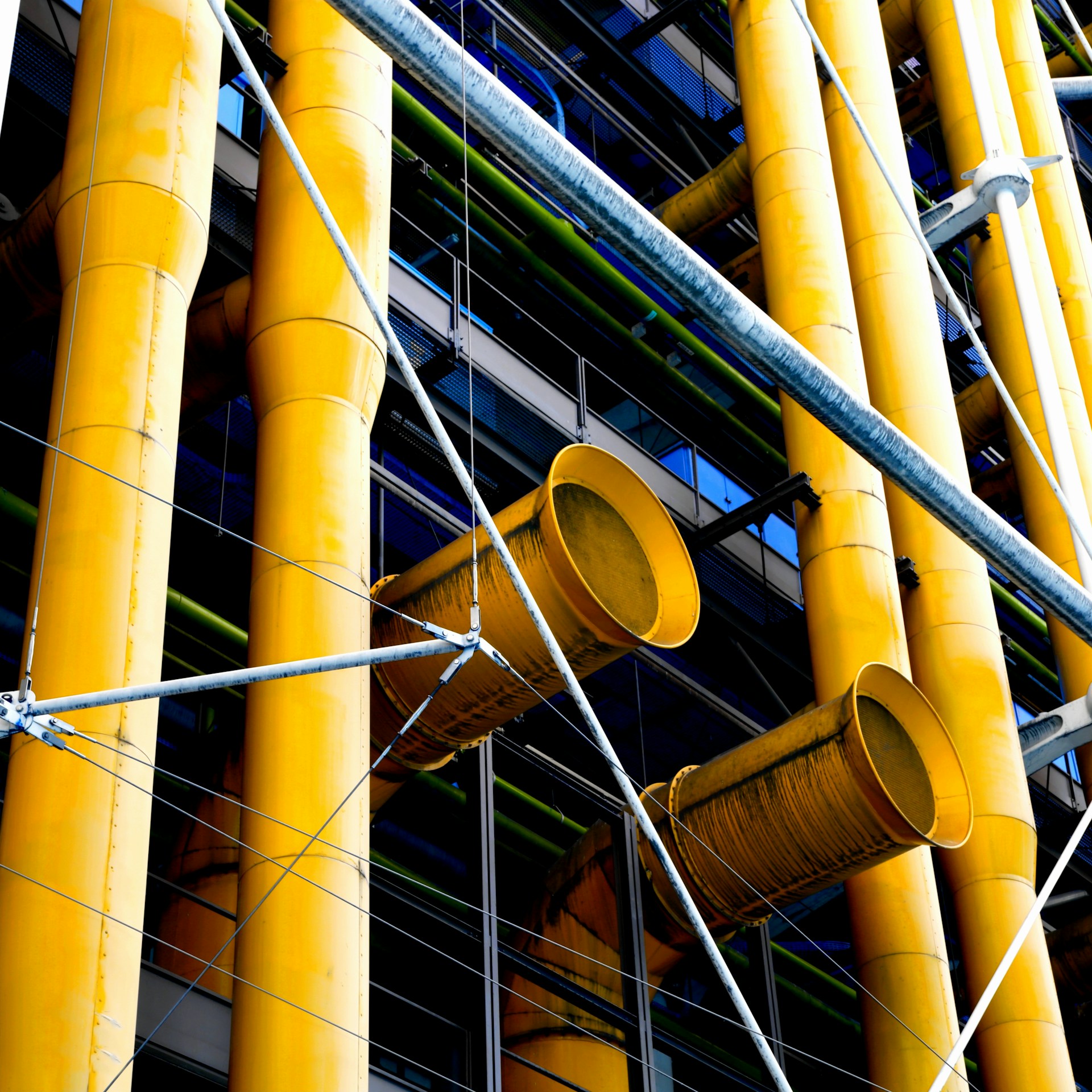 woman wearing yellow long-sleeved dress under white clouds and blue sky during daytime