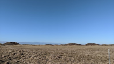 Open land stretching under a clear blue sky, inviting possibilities