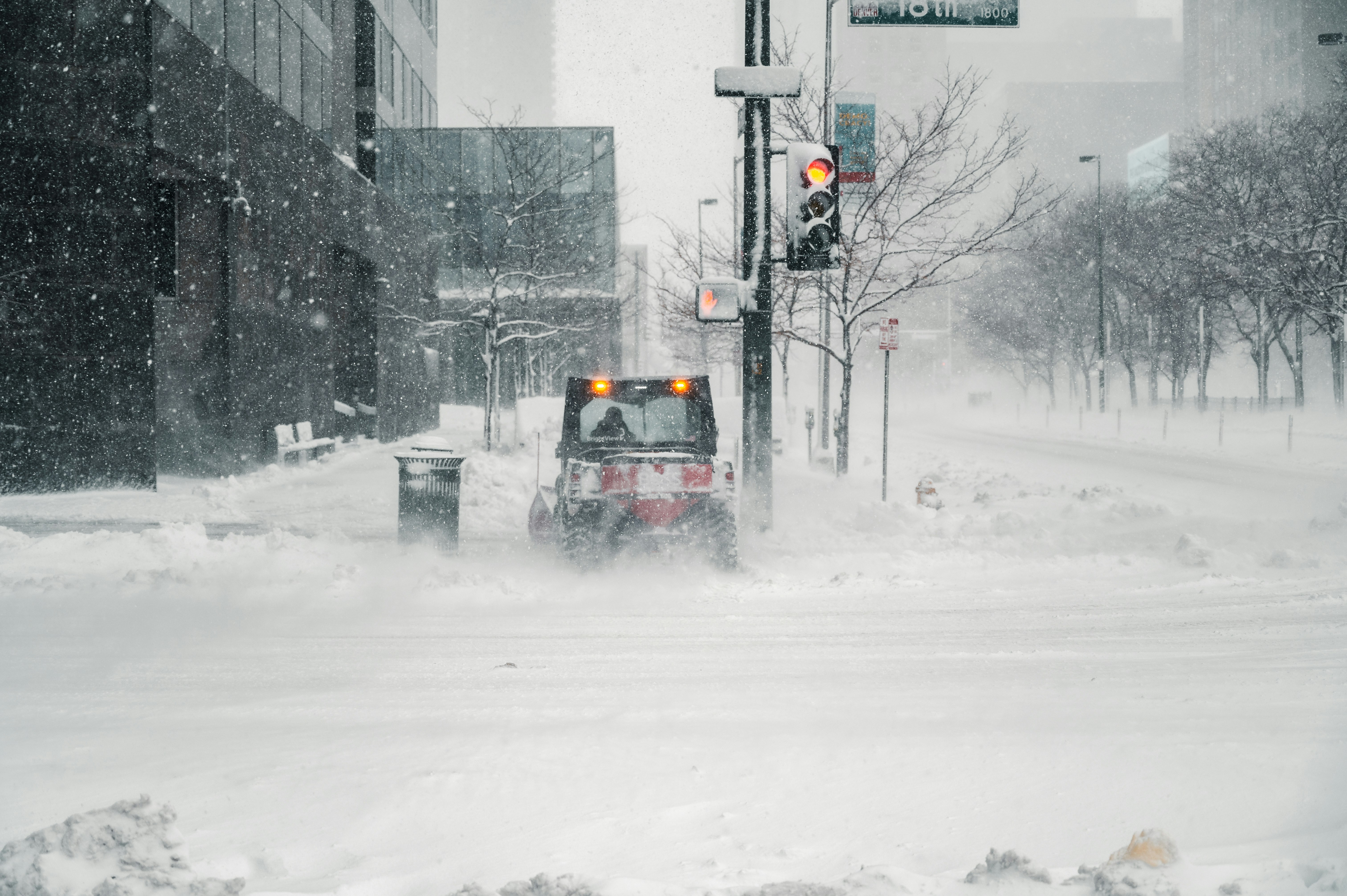 black car on snow covered road during daytime