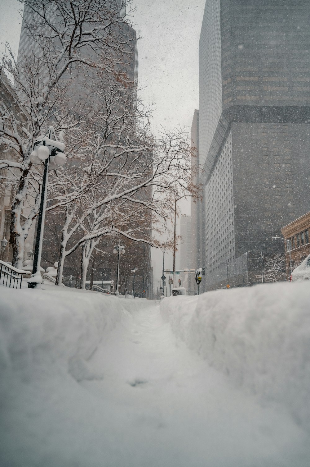 brown concrete building covered with snow during daytime