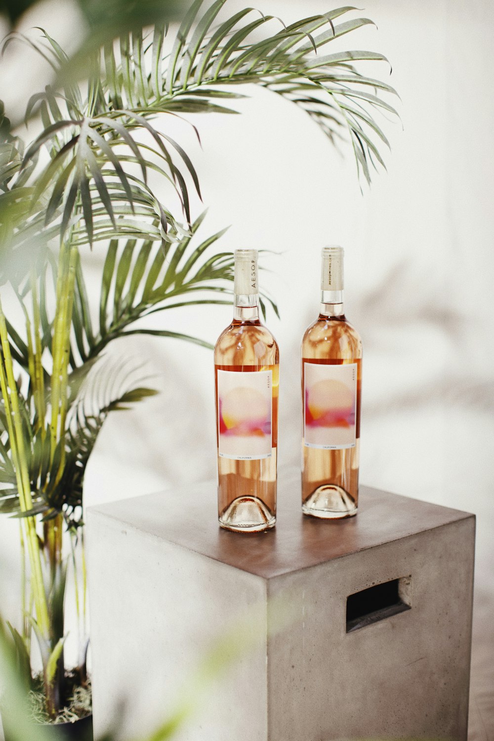 two bottles on black wooden table