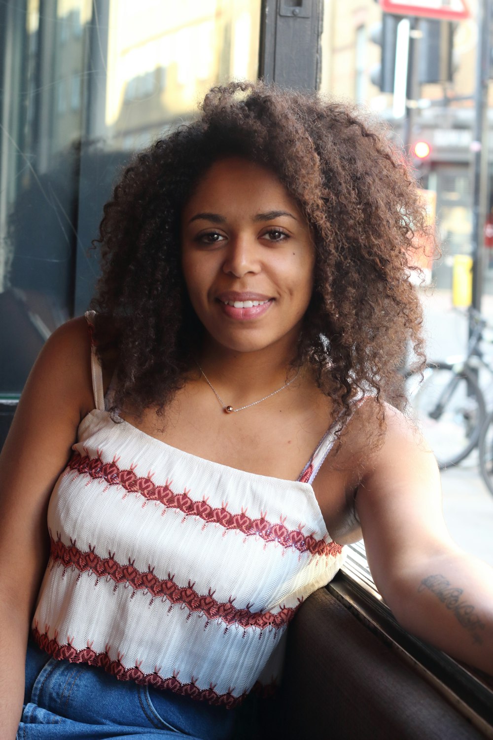 woman in white and red spaghetti strap top