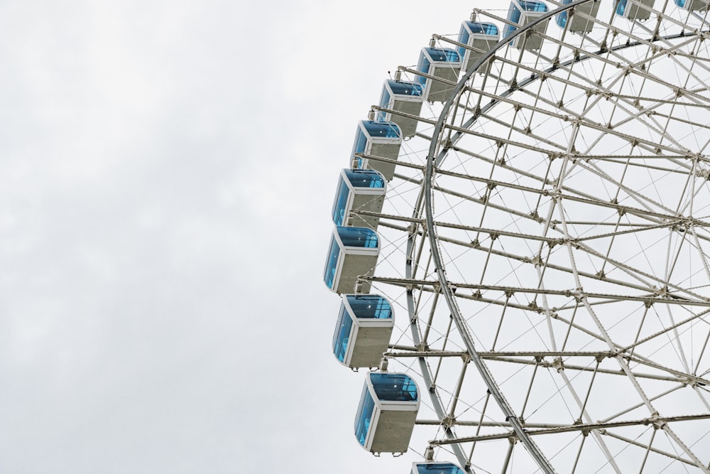 white ferris wheel under blue sky during daytime