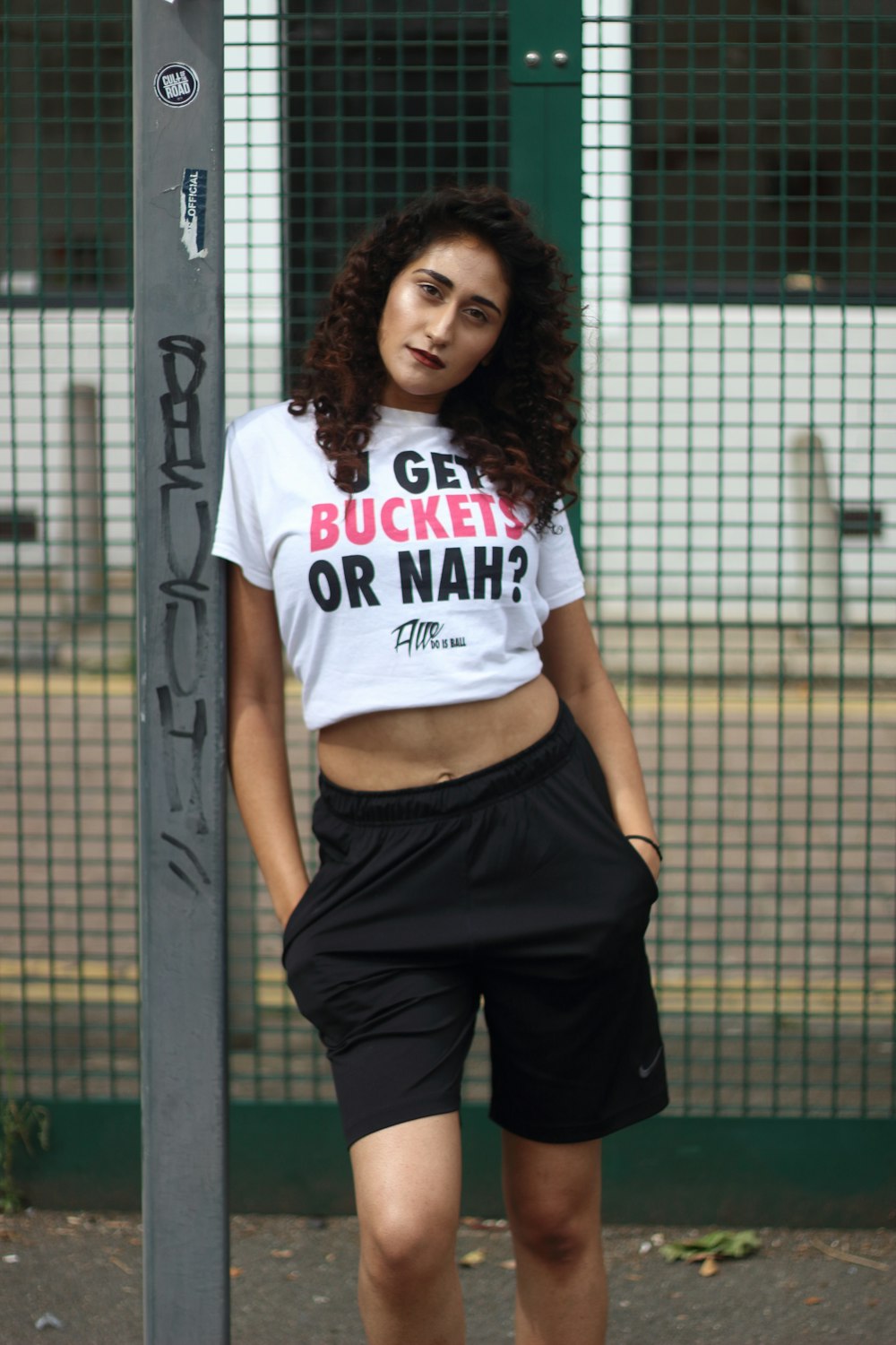 woman in white crew neck t-shirt and black pants