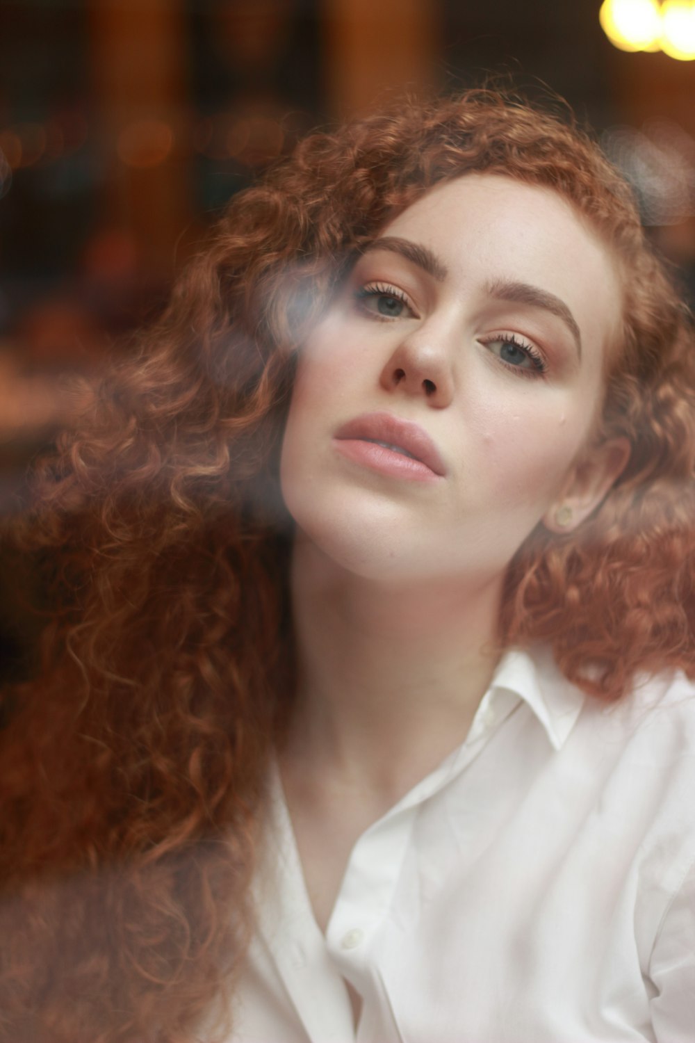 woman in white collared shirt