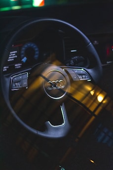 black and silver mercedes benz steering wheel