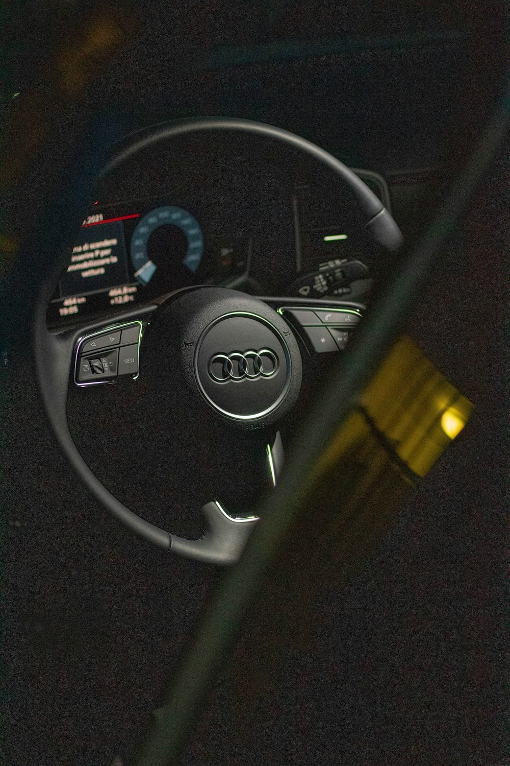 black and yellow car steering wheel