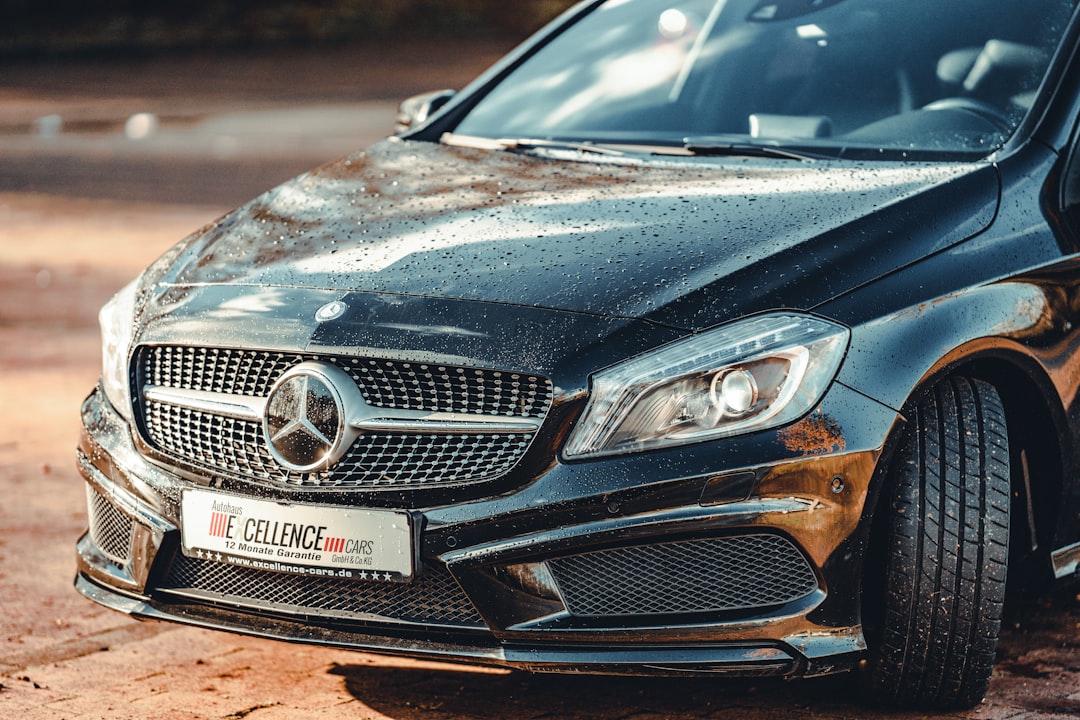 black mercedes benz car on road during daytime