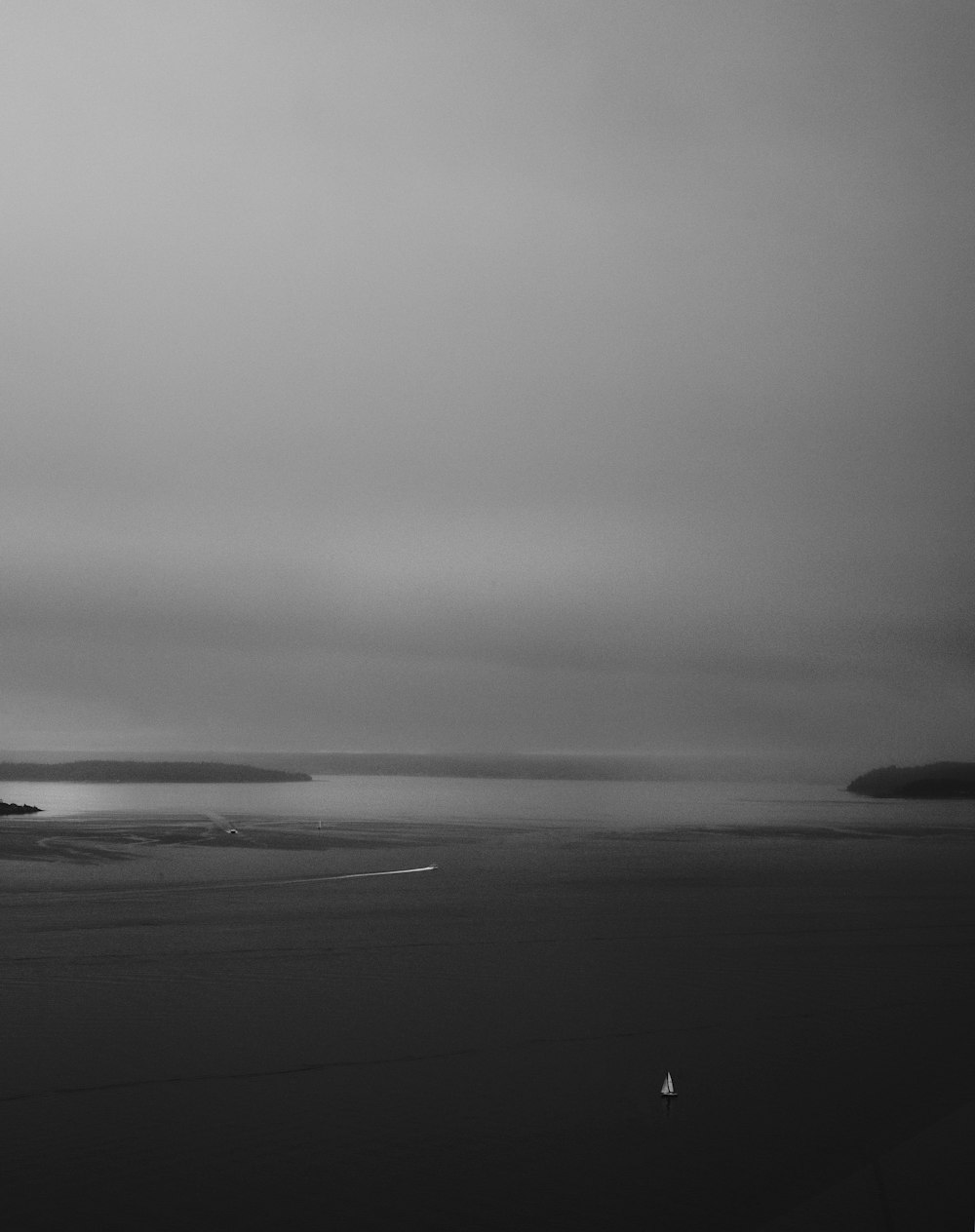 body of water under cloudy sky during daytime