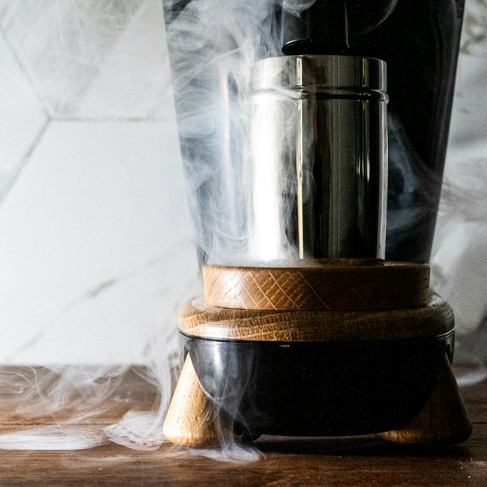 stainless steel container on brown wooden table