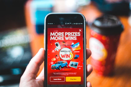 red and black smartphone showing game application