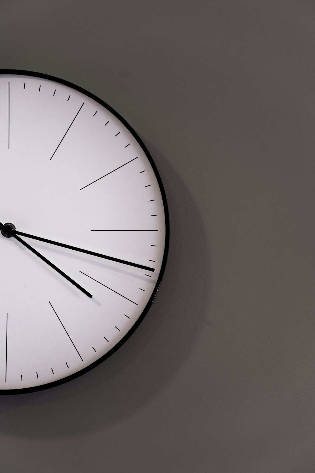  white analog wall clock at 11 00 clock