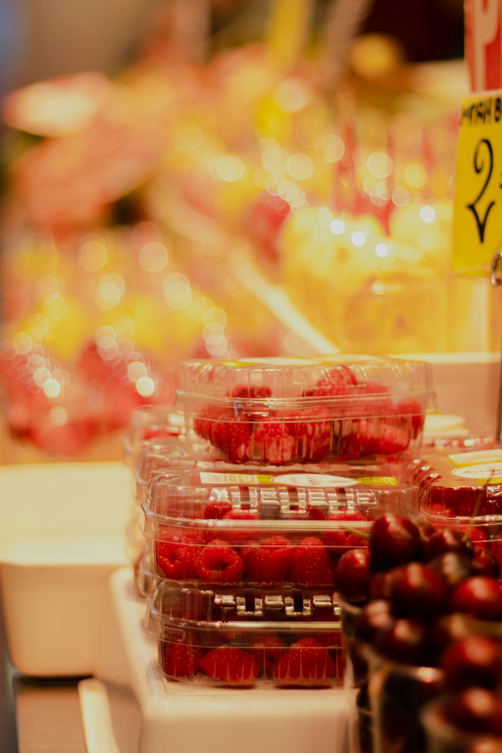 red cherries in clear plastic container