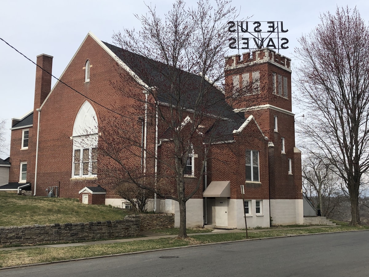 Suburban single-family home with a well-manicured lawn representing the American housing market