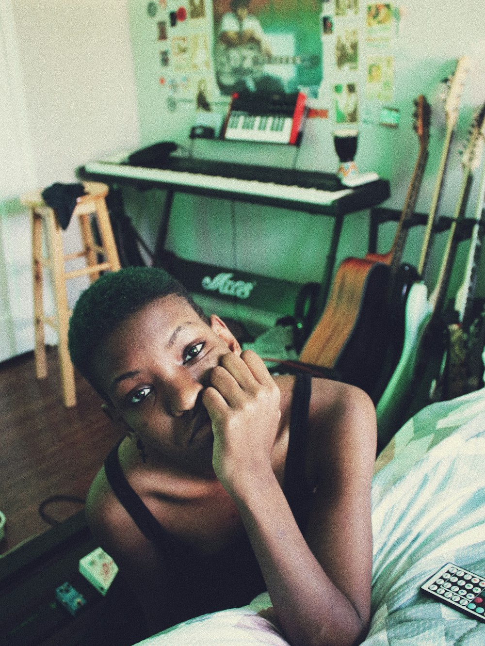 woman in black tank top sitting on bed