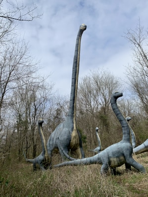 gray elephant statue on green grass field during daytime