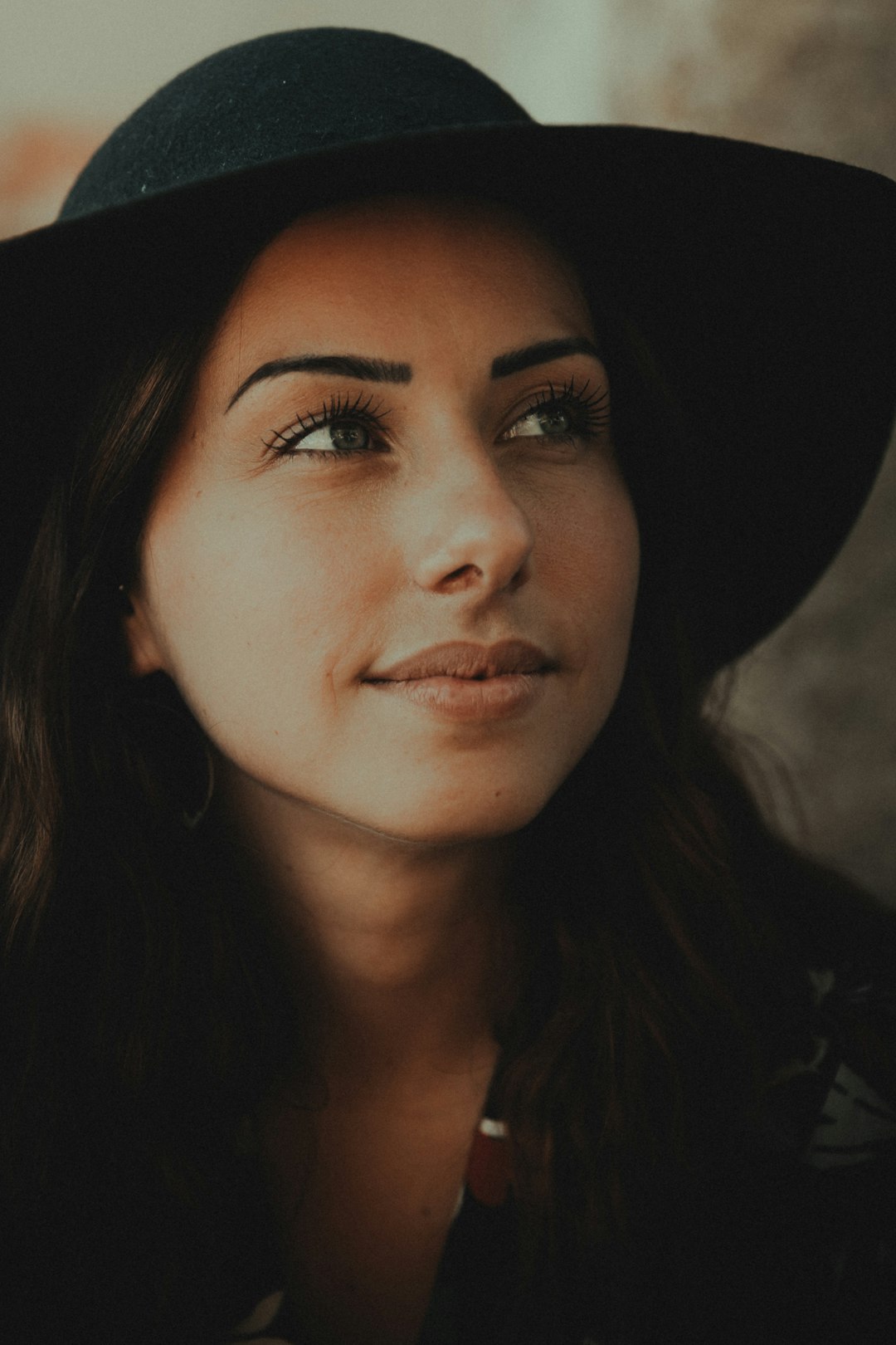 woman in black hat and black shirt