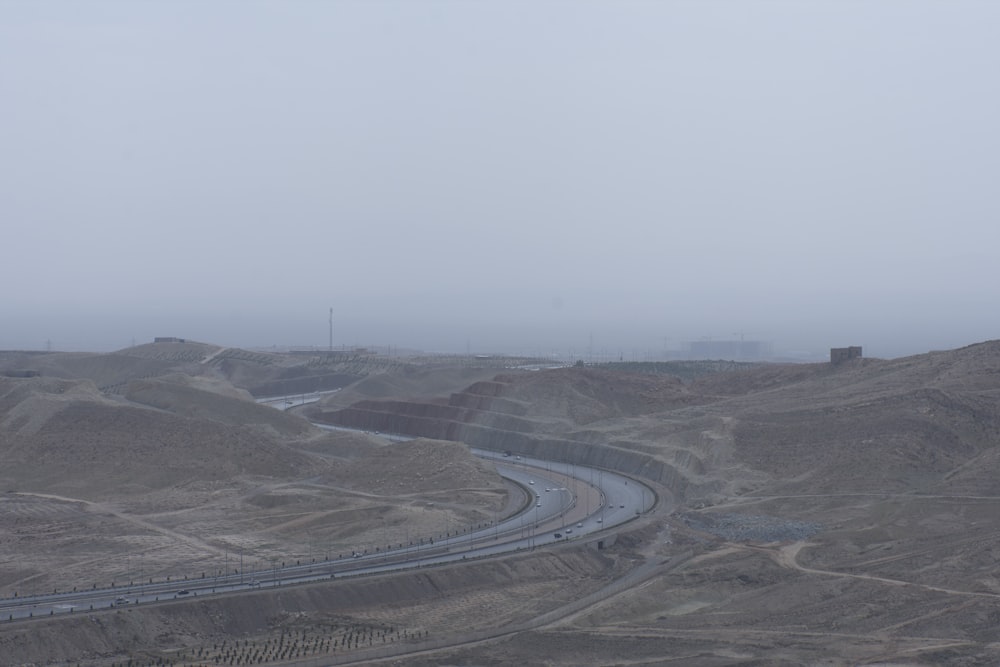 gray asphalt road under gray sky during daytime