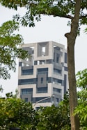 white concrete building with glass windows