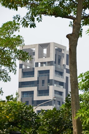 white concrete building with glass windows