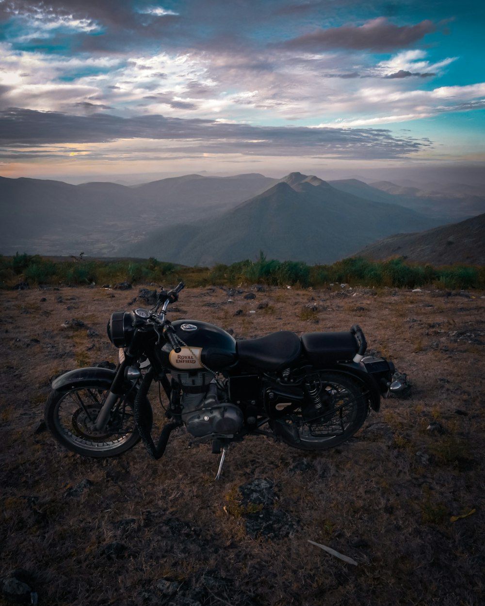 black motorcycle on brown field during daytime