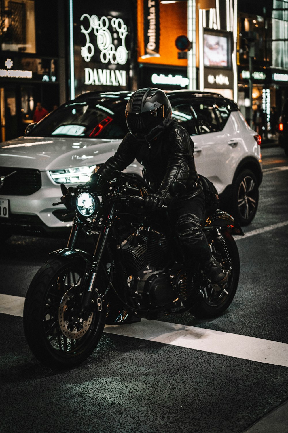 man in black motorcycle helmet riding motorcycle