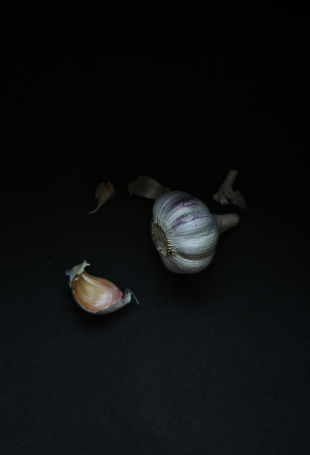 garlic on black table top