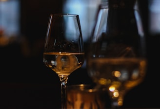 clear wine glass with brown liquid