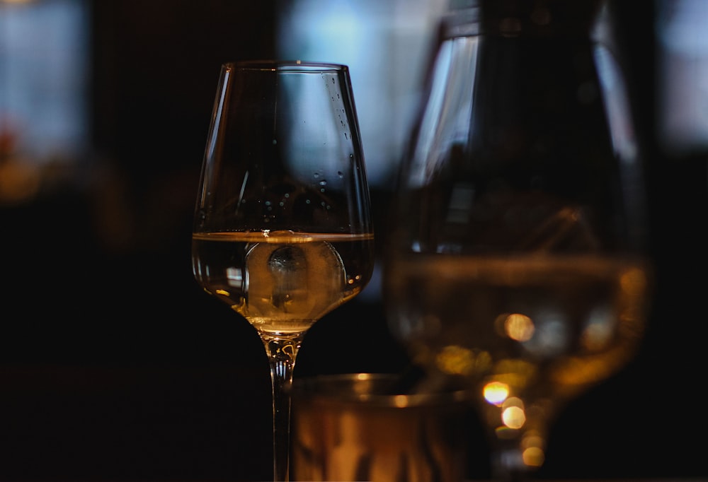 clear wine glass with brown liquid