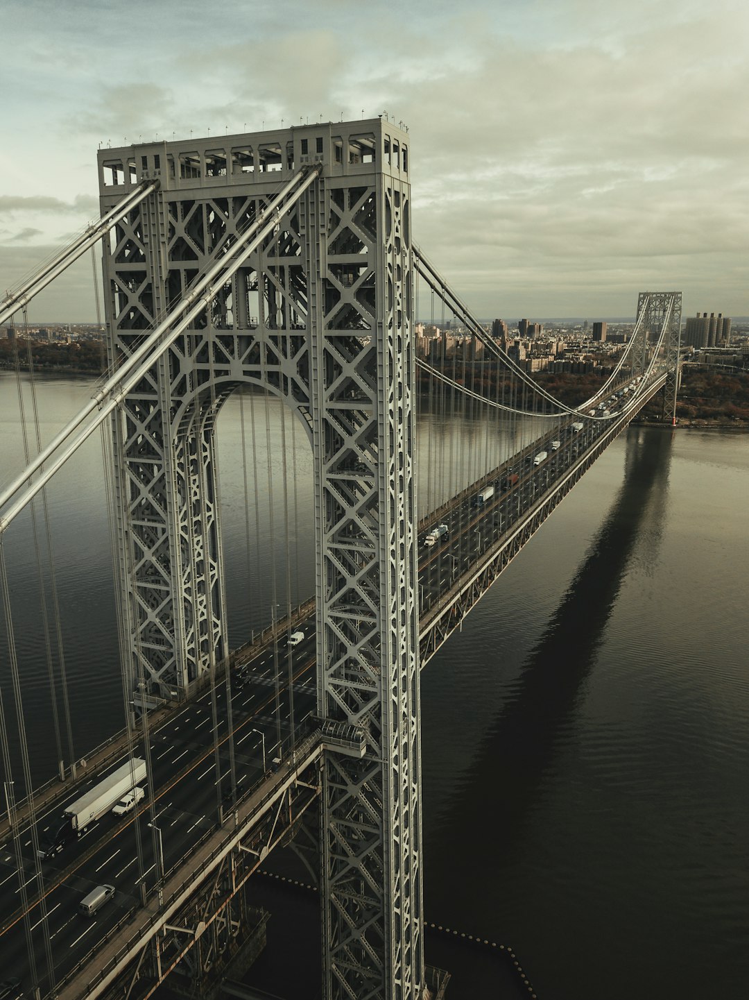 gray steel bridge over body of water during daytime