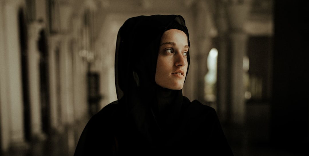 woman in black hijab standing
