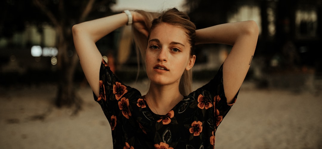 woman in black and red floral dress