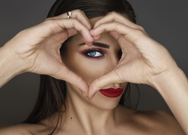 woman covering her face with her hand