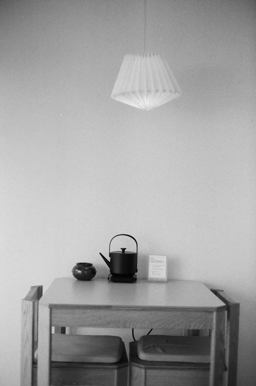 black and white table lamp on black wooden table