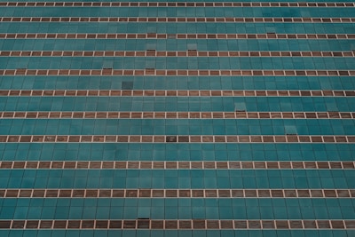 Aerial view of a commercial building with glass facade.
