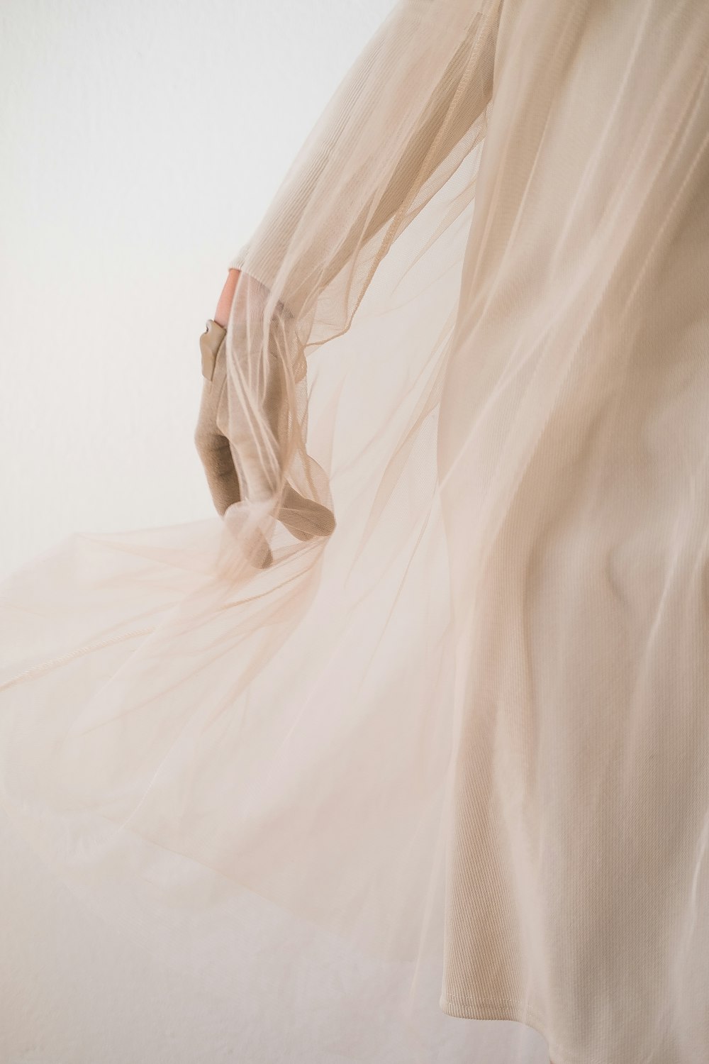 white textile on white background